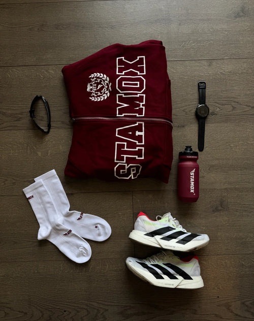 Stamox beetroot powder sports kit with socks, sneakers, bottle, sweatshirt, watch, and glasses