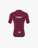 Maroon cycling jersey with Stamox Beetroot Powder logo and branding, rear view.