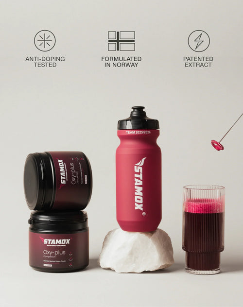 Stamox beetroot powder containers, shaker bottle, and glass of mixed beetroot drink on display