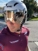 Cyclist wearing Stamox Beetroot Powder jersey and helmet outdoors, promoting endurance supplement