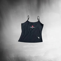 Black tank top with logos on a dark background stamox