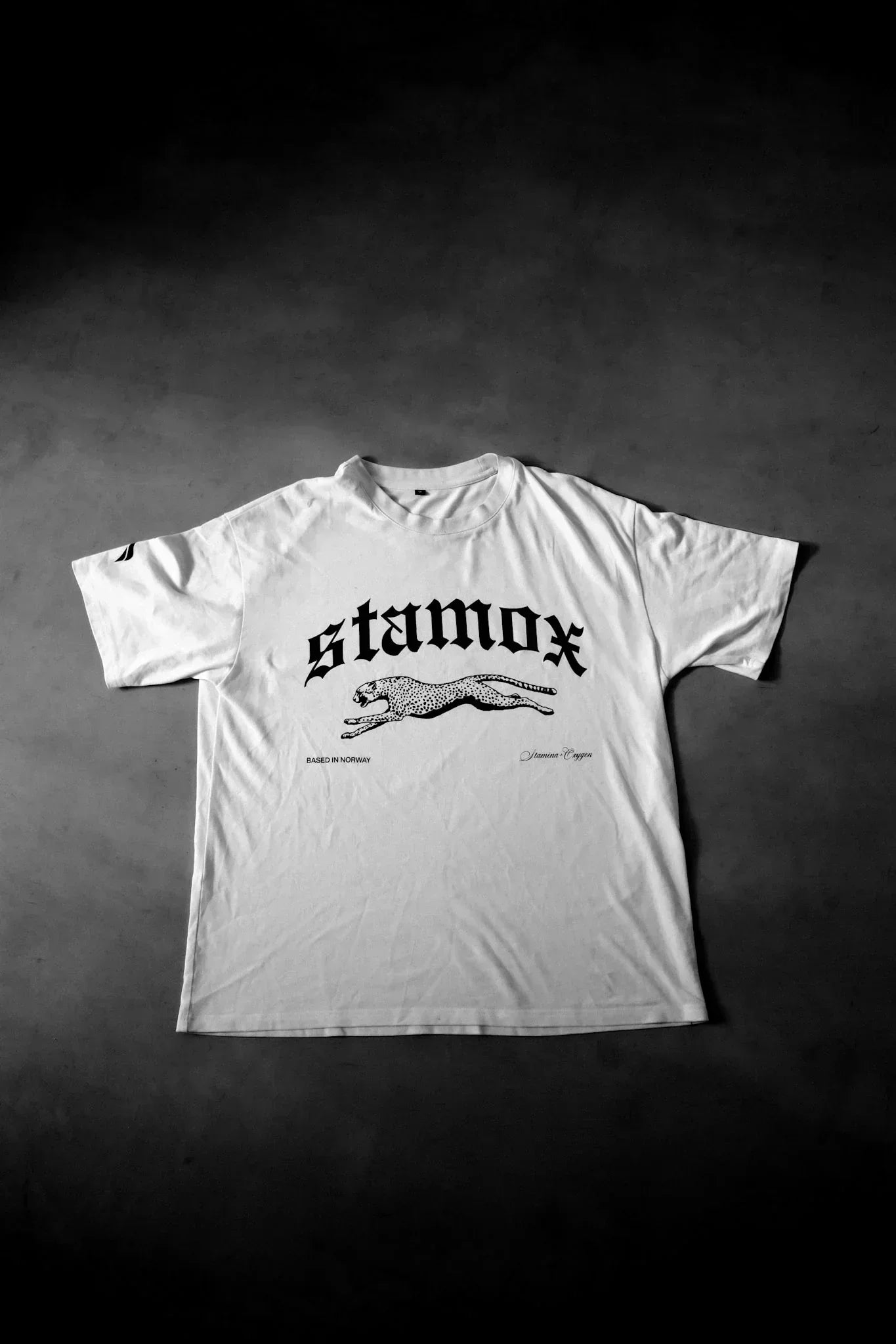 White Stamox beetroot powder t-shirt with cheetah logo on gray background
