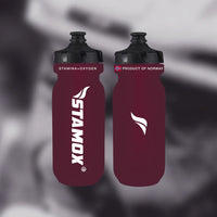 Two maroon water bottles with black lids on a blurred background