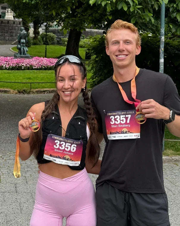 Runners holding medals after a race, showcasing stamox beetroot powder benefits for endurance.