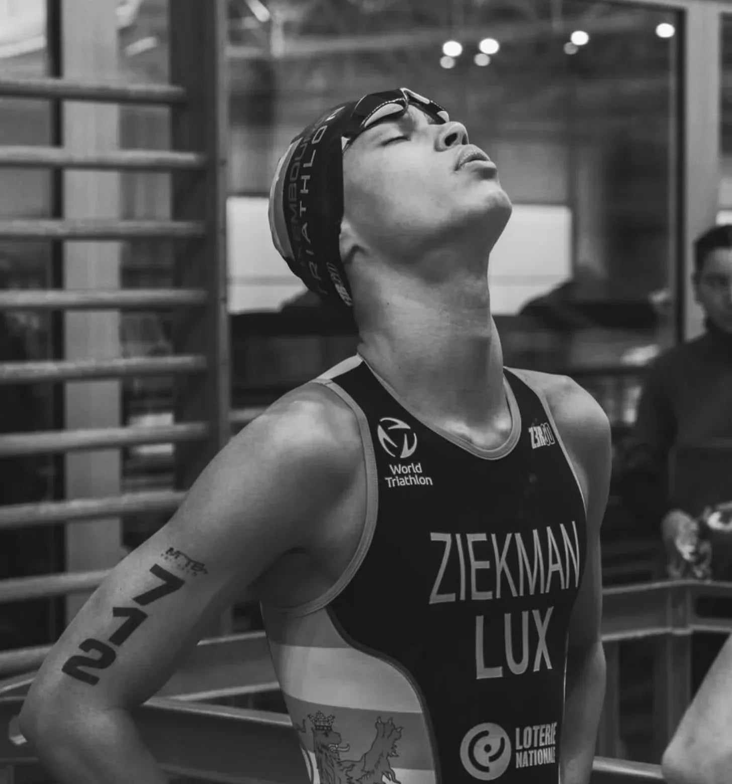 Triathlete preparing for race, wearing gear, with stamox beetroot powder endurance theme