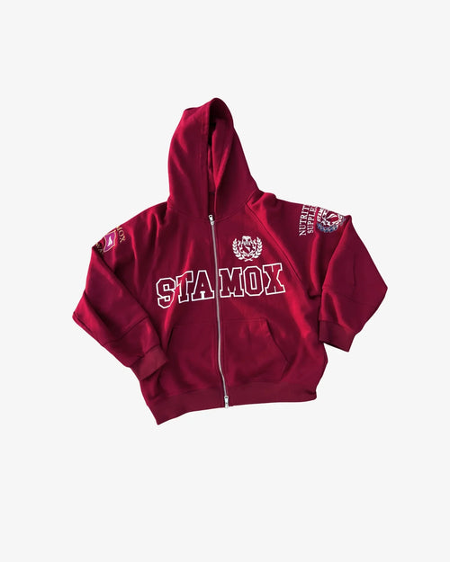 Red zip-up hoodie with stamox beetroot powder branding, college style lettering