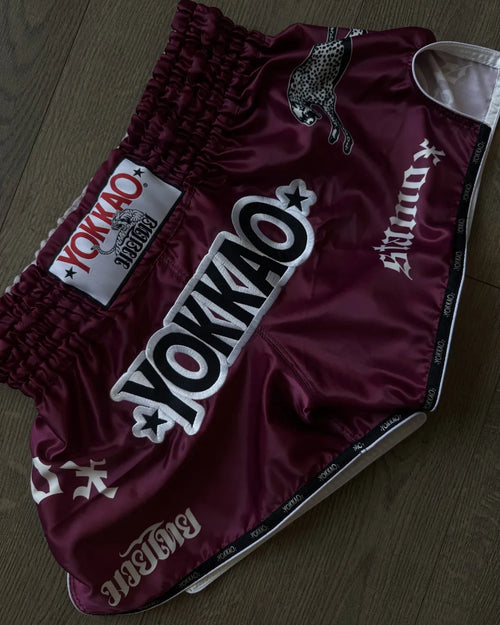 Stamox beetroot powder for endurance and recovery, paired with YOKKAO boxing shorts for athletic performance.