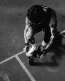 Athlete on track mixing beetroot powder for endurance and recovery boost