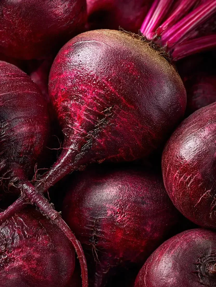 Fresh organic beetroots with vibrant red skin and stems, natural source for beetroot powder supplements
