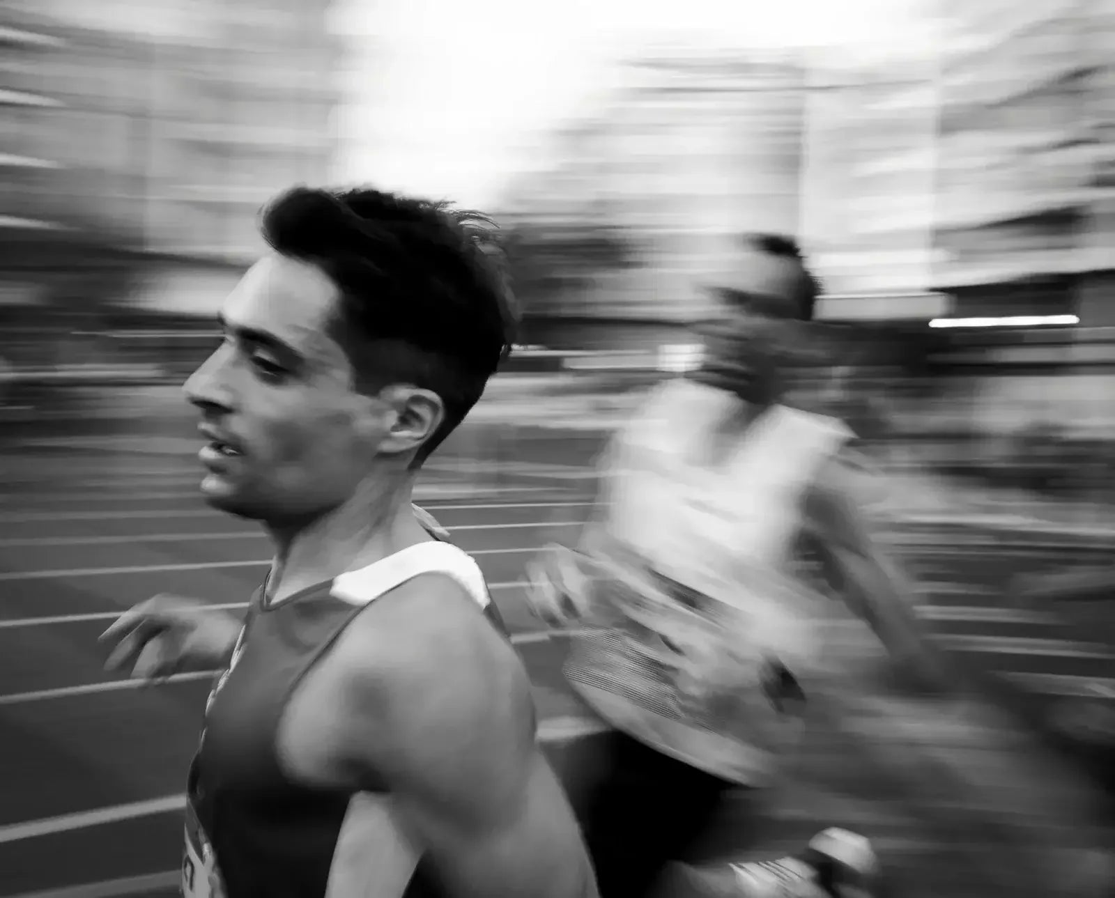 Runner in motion on track, stamox beetroot powder for endurance and athletic performance