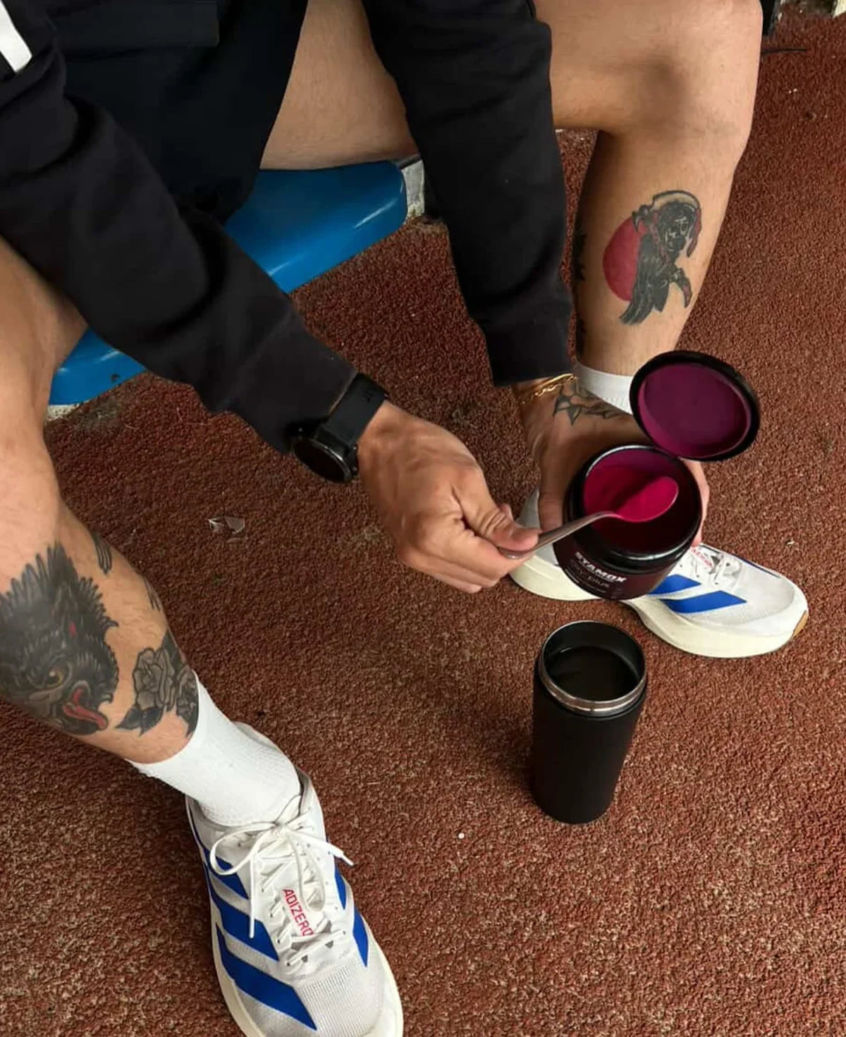 Person preparing Stamox beetroot sport nutrition for VO2 max optimization.