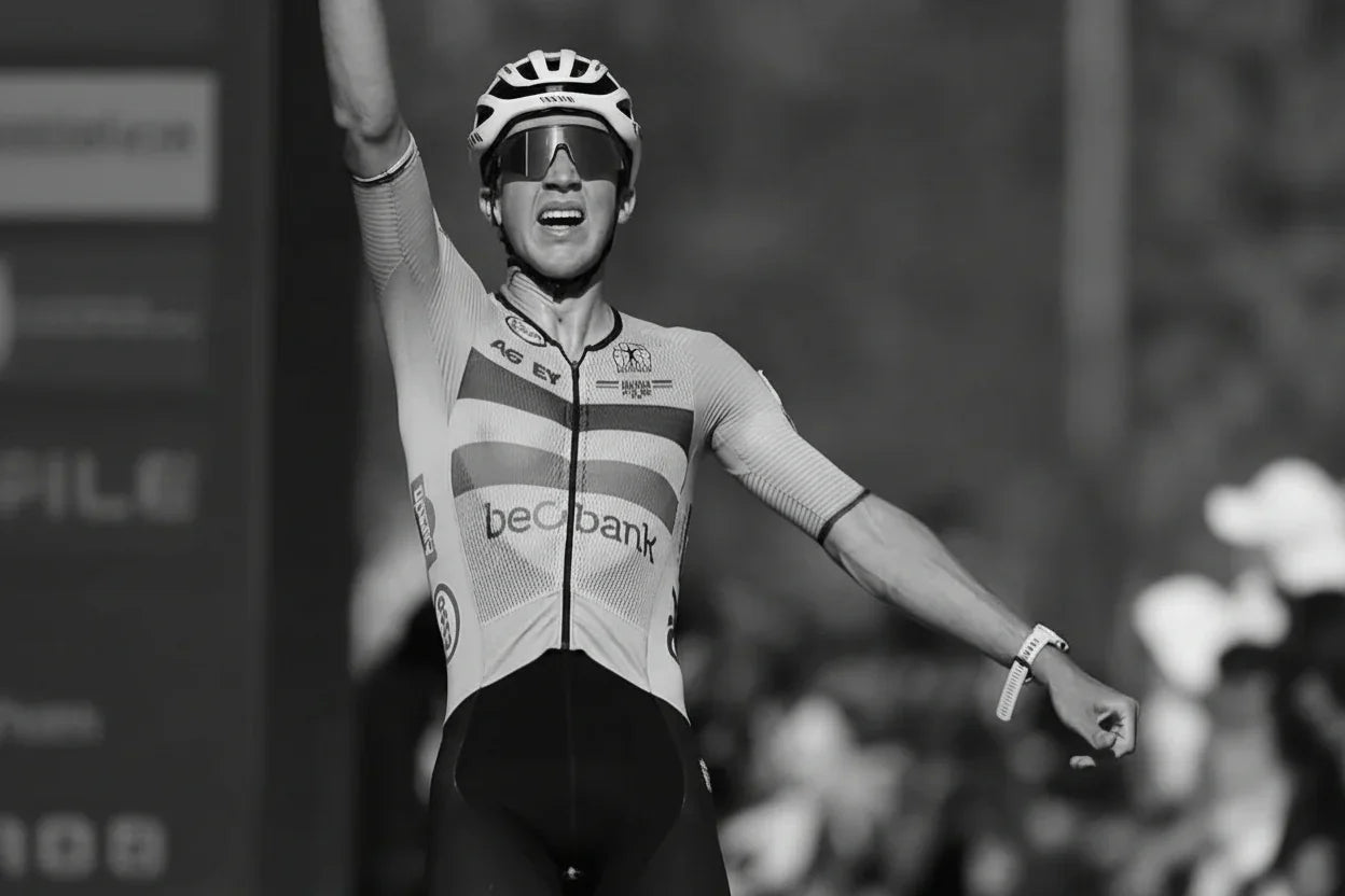 Cyclist celebrating race win, showcasing endurance supported by stamox beetroot powder