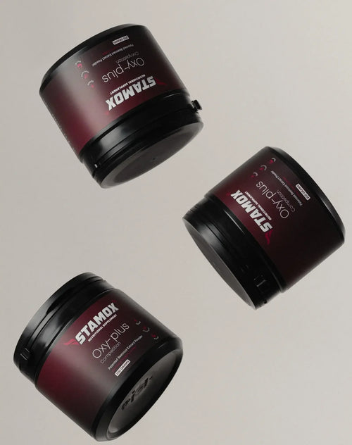 Three tubs of Stamox beetroot powder dietary supplement on a neutral background