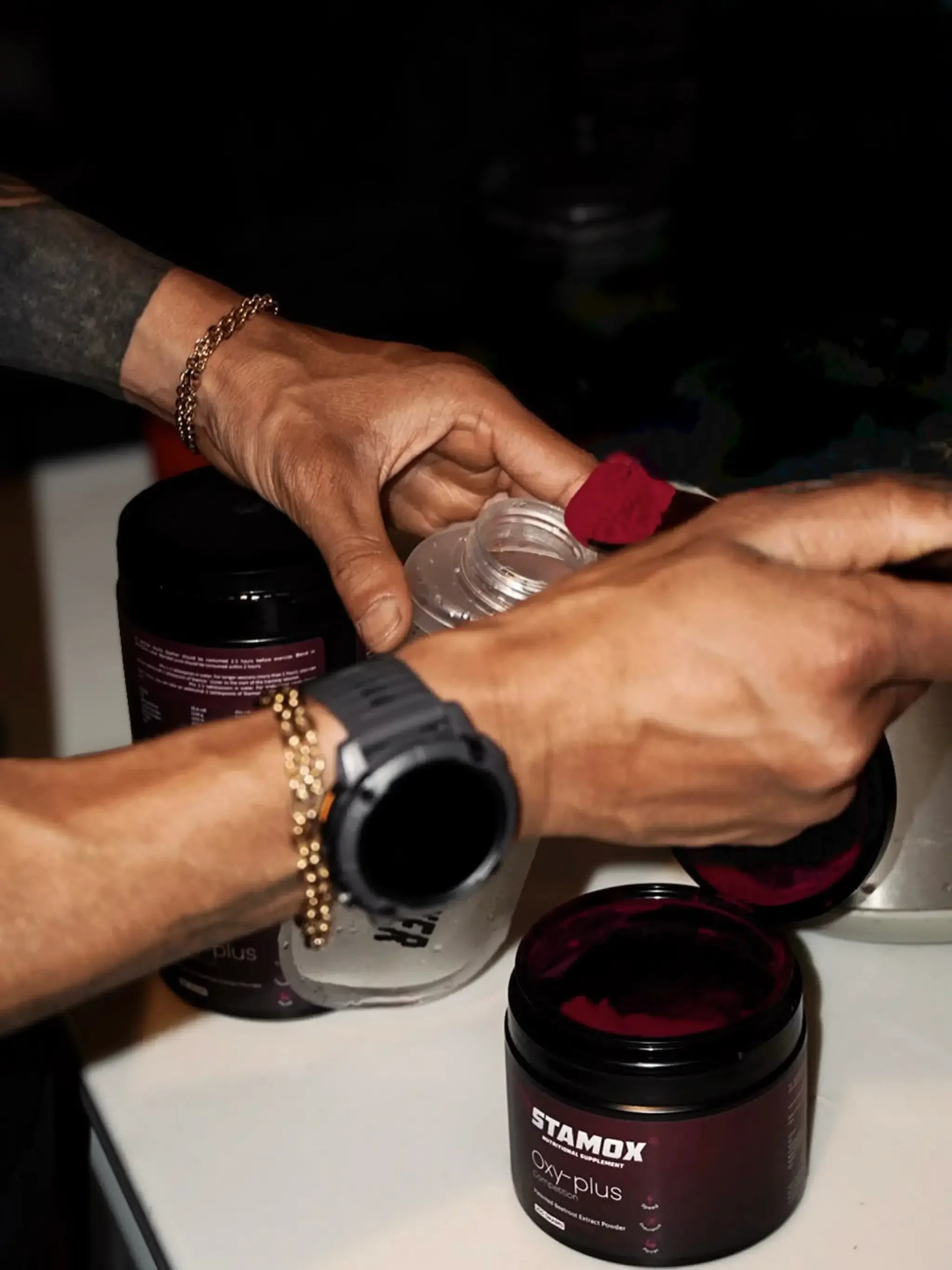 Scoop of Stamox beetroot powder being added to shaker bottle for natural endurance support