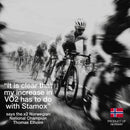 Black and white image of cyclists racing, featuring Stamox beetroot powder endorsement by Norwegian champion