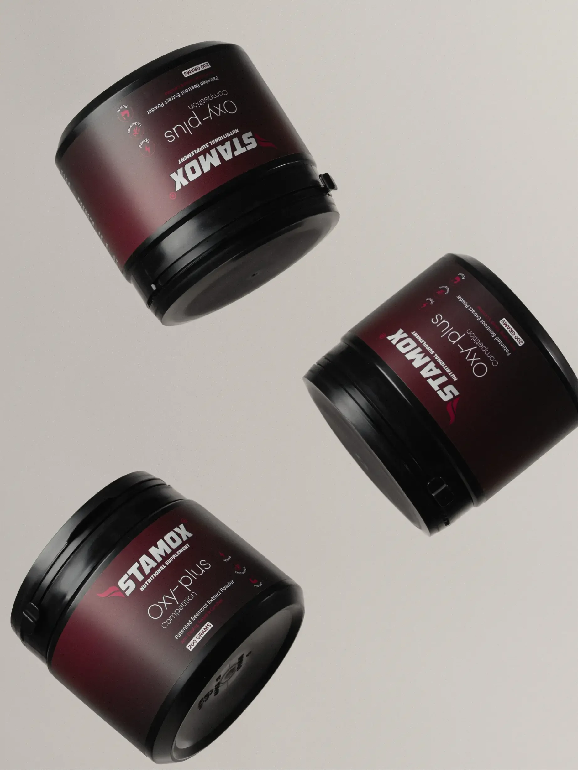 Three Stamox beetroot powder tubs on a neutral background for endurance and energy.
