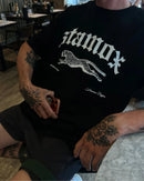 Person wearing a black Stamox beetroot sport nutrition VO2 max t-shirt with a leopard graphic.