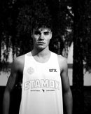 Athlete wearing STAMOX branded tank top, promoting stamox beetroot powder supplement