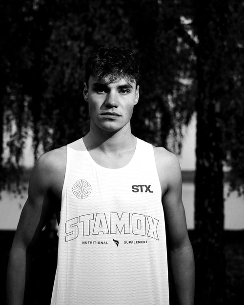 Athlete wearing STAMOX branded tank top, promoting stamox beetroot powder supplement